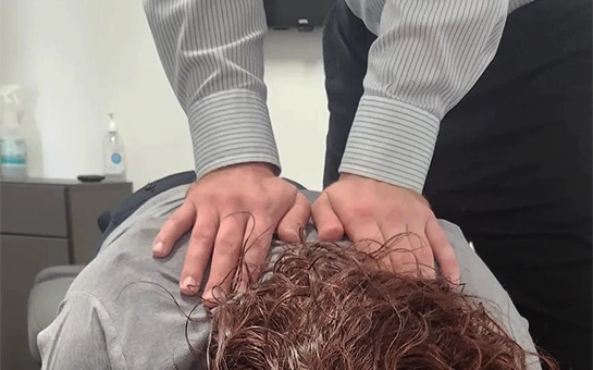 Patient Reciving A Spine Adjustment